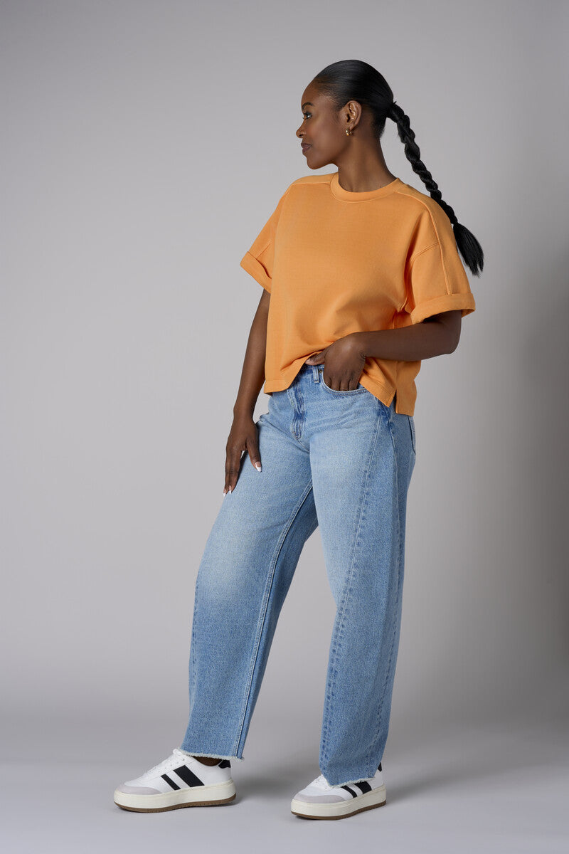 Experience the bold look of our 'Vintage Whisker Wash' Barrel Leg Jean.