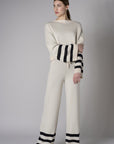 Step up your look with this unique 'Sand' Striped Leg Pant.