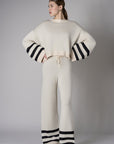 Step up your look with this unique 'Sand' Striped Leg Pant.