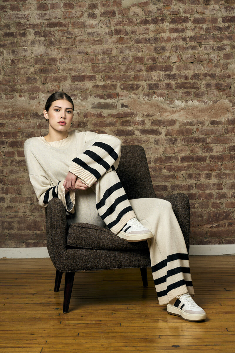 Step up your look with this unique 'Sand' Striped Leg Pant.