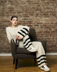 Step up your look with this unique 'Sand' Striped Leg Pant.