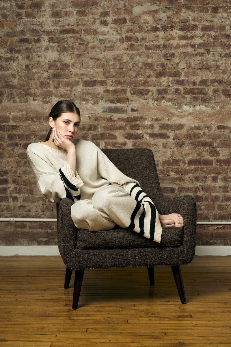 Step up your look with this unique 'Sand' Striped Leg Pant.