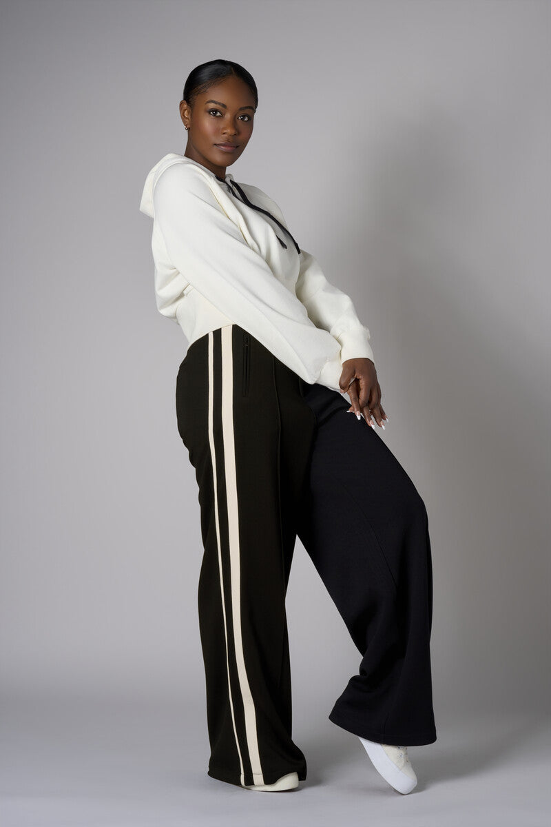 Create your signature style with our 'Black' Trouser Track Pant.