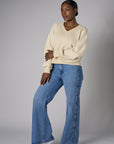 Bring your style to life with the 'Bone White' Zipper Back V-Neck Sweatshirt – perfect for any occasion.