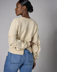 Bring your style to life with the 'Bone White' Zipper Back V-Neck Sweatshirt – perfect for any occasion.