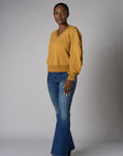 Be unforgettable in the elegant 'Marigold' Zipper Back V-Neck Sweatshirt.