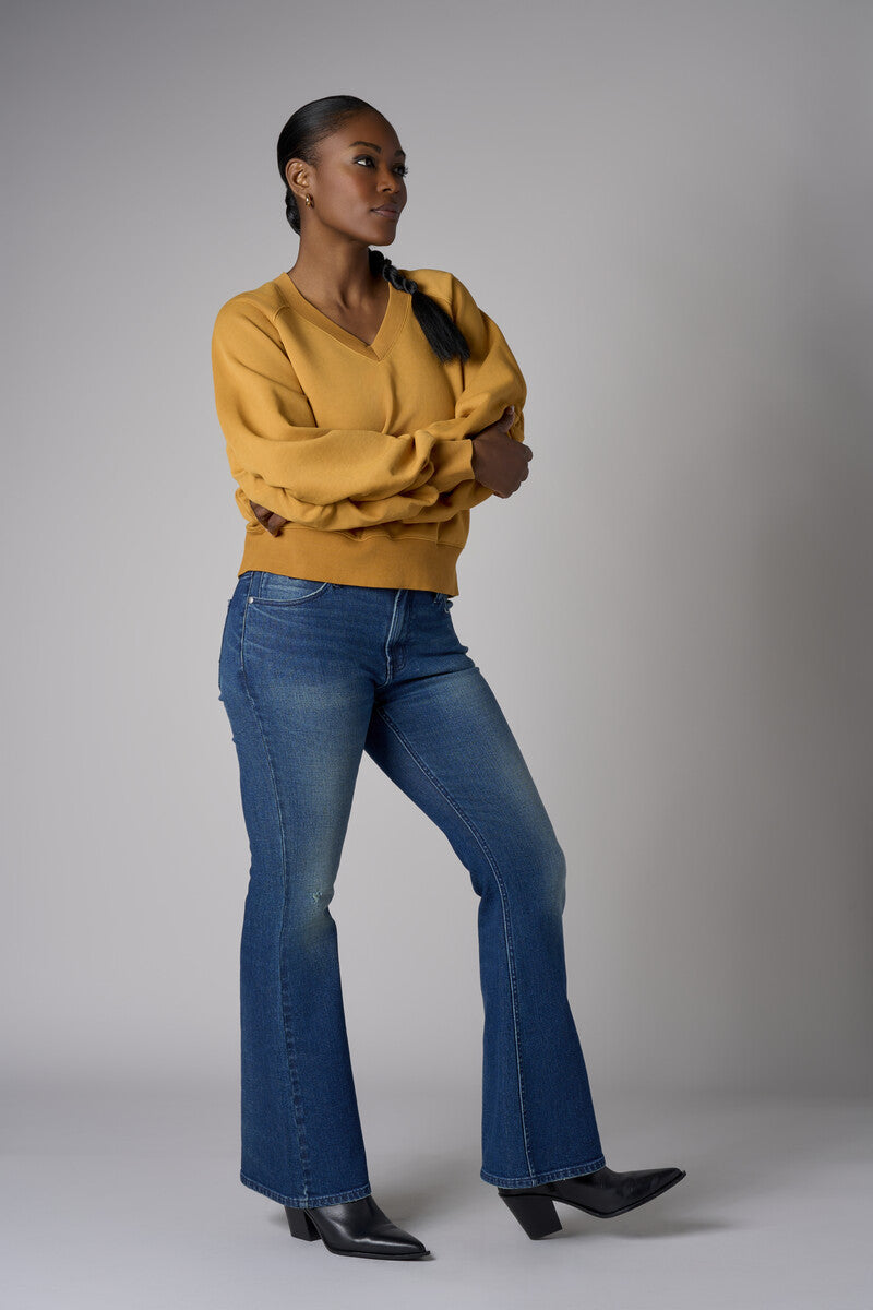 Be unforgettable in the elegant 'Marigold' Zipper Back V-Neck Sweatshirt.