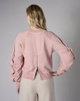Experience the premium look of our 'Rose' Zipper Back V-Neck Sweatshirt.