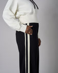 Add a pop of color to your look with the 'Ivory' Cropped Hoodie Sweatshirt.