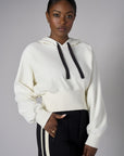 Add a pop of color to your look with the 'Ivory' Cropped Hoodie Sweatshirt.