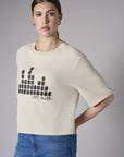 Bring your style to life with the 'Bone White' Coram Graphic T-Shirt – perfect for any occasion.
