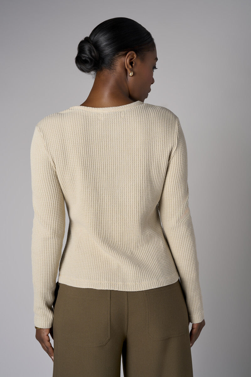 Upgrade your collection with the fashion-forward 'Khaki' Henley Top.
