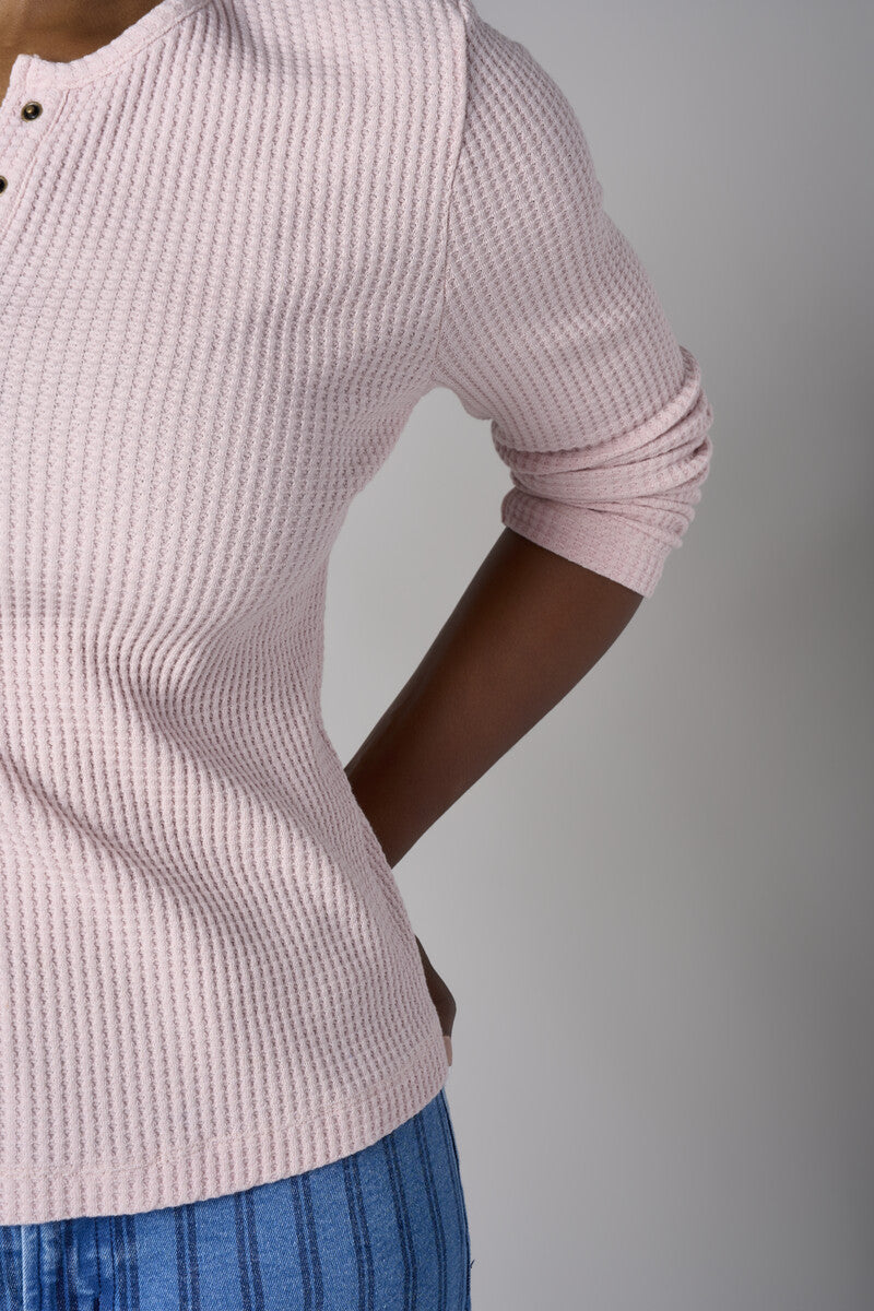 Feel fabulous every day in the 'Petal' Henley Top, crafted for those who love versatile style.