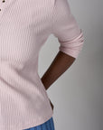 Feel fabulous every day in the 'Petal' Henley Top, crafted for those who love versatile style.