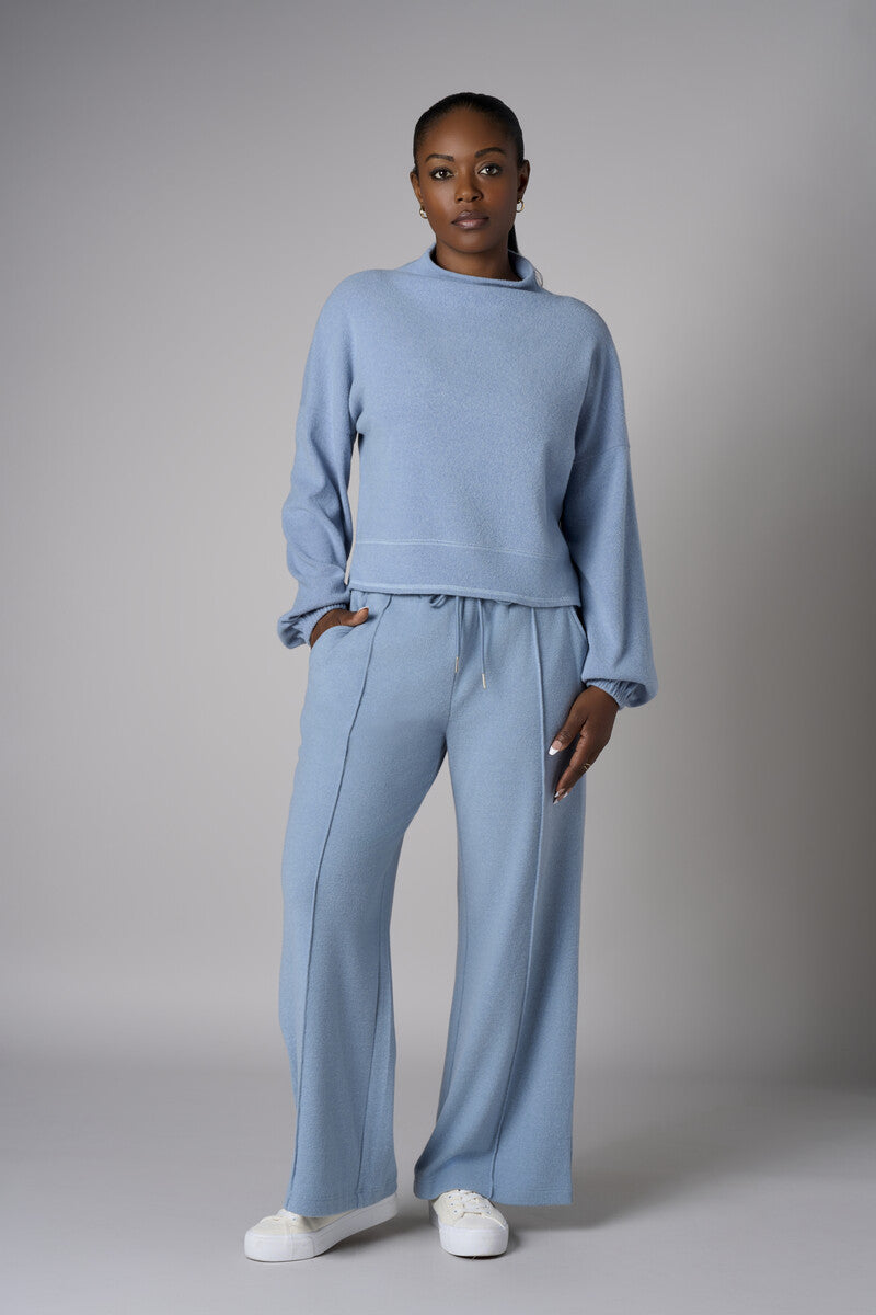 A stunning twist: the 'Sky' Funnel Neck Top brings freshness to your style.