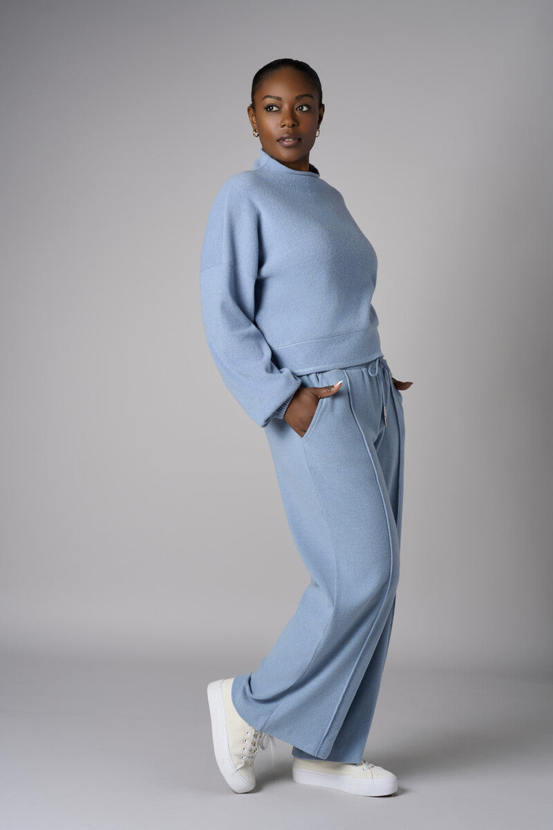 A stunning twist: the 'Sky' Funnel Neck Top brings freshness to your style.