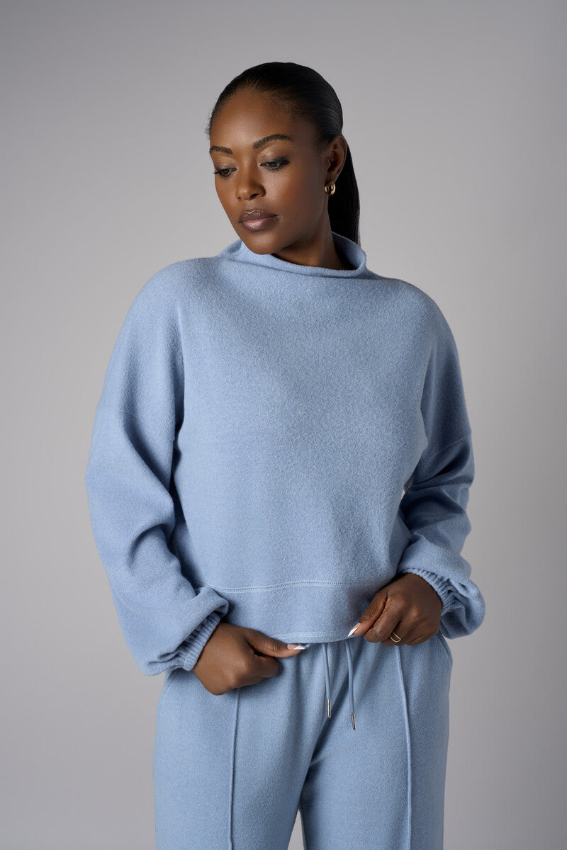 A stunning twist: the 'Sky' Funnel Neck Top brings freshness to your style.