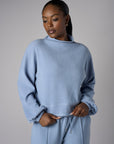 A stunning twist: the 'Sky' Funnel Neck Top brings freshness to your style.