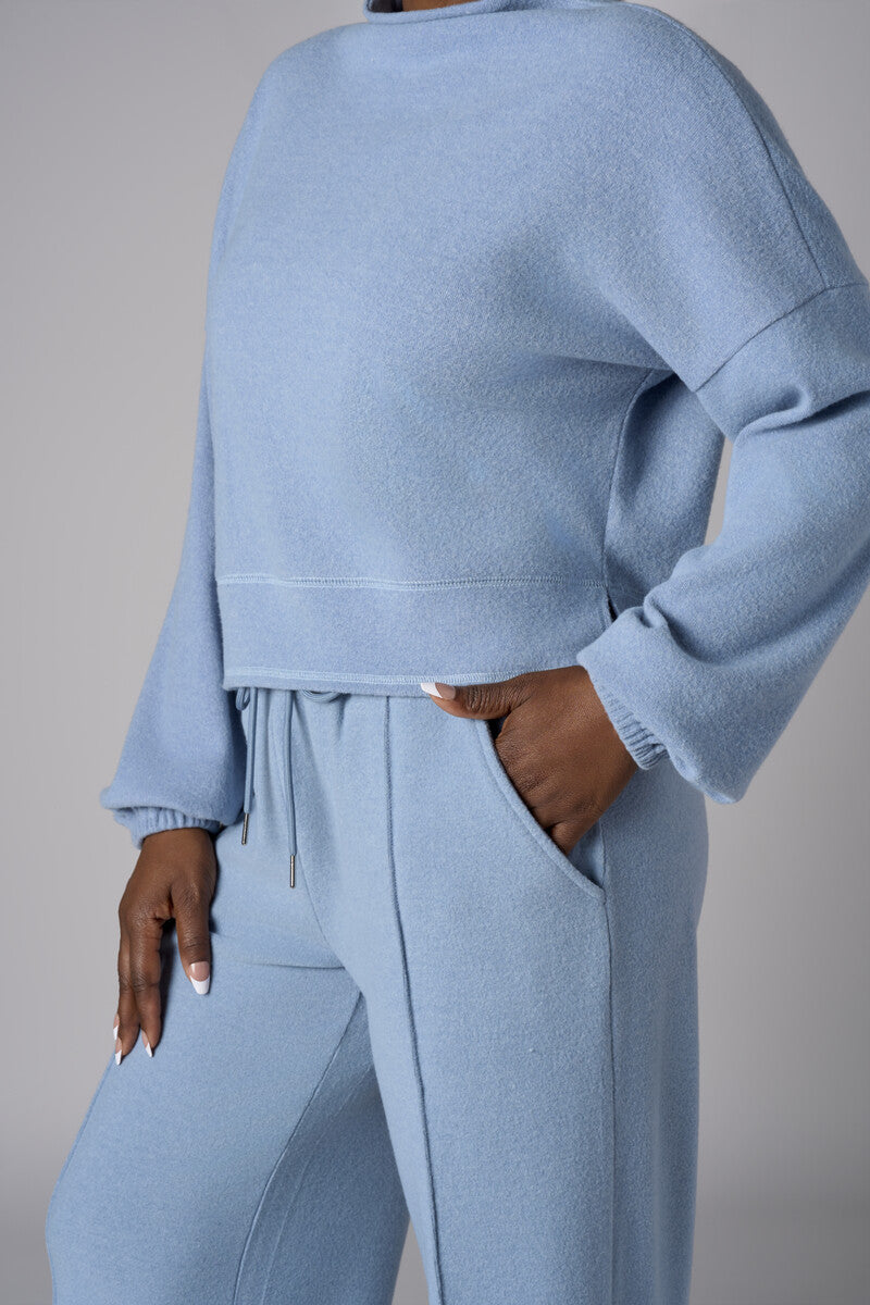 A stunning twist: the 'Sky' Funnel Neck Top brings freshness to your style.