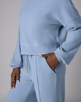A stunning twist: the 'Sky' Funnel Neck Top brings freshness to your style.