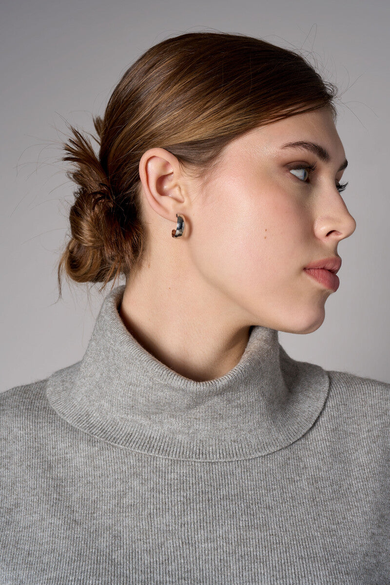 Gray sleeveless turtleneck sweater