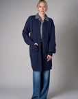 Twilight cardigan with denim collar and button front closure.