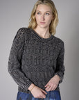 Turn heads with this warm 'Black' Crew Neck Distressed Sweater.