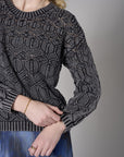 Turn heads with this warm 'Black' Crew Neck Distressed Sweater.