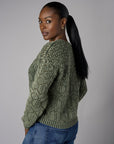 Fall in love with the distinctive 'Olive' Crew Neck Distressed Sweater – a must-have for any wardrobe.
