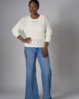 Embrace the beauty of 'Sand' in our signature Crew Neck Distressed Sweater.