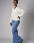 Embrace the beauty of 'Sand' in our signature Crew Neck Distressed Sweater.