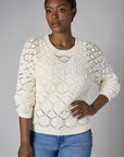 Embrace the beauty of 'Sand' in our signature Crew Neck Distressed Sweater.