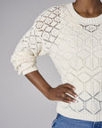 Embrace the beauty of 'Sand' in our signature Crew Neck Distressed Sweater.