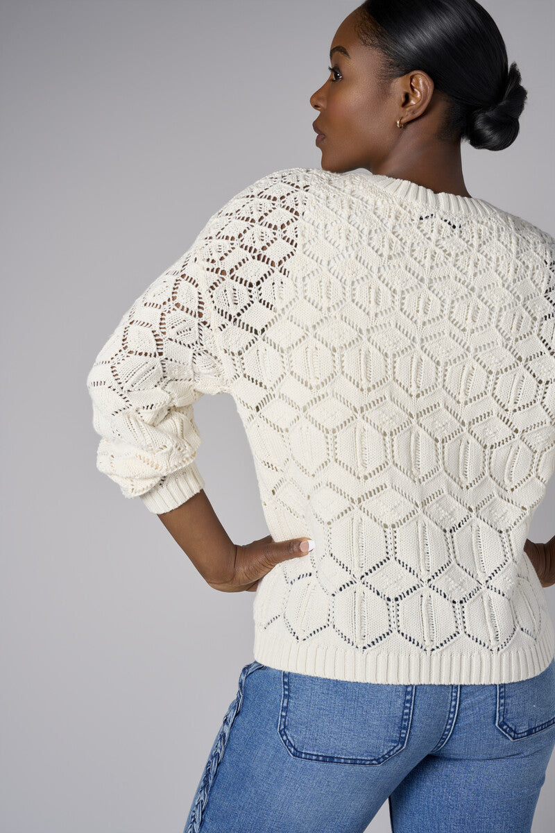 Embrace the beauty of 'Sand' in our signature Crew Neck Distressed Sweater.