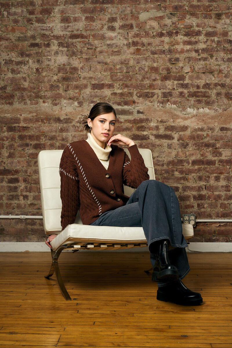 brown cardigan with contrast whipstitch trim and button front closure.