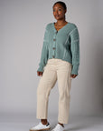 Seafoam cardigan with contrast whipstitch trim and button front closure.