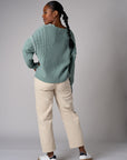 Seafoam cardigan with contrast whipstitch trim and button front closure.