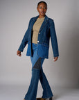Two tone denim blazer with button front closure and front flap pockets.