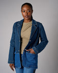 Two tone denim blazer with button front closure and front flap pockets.