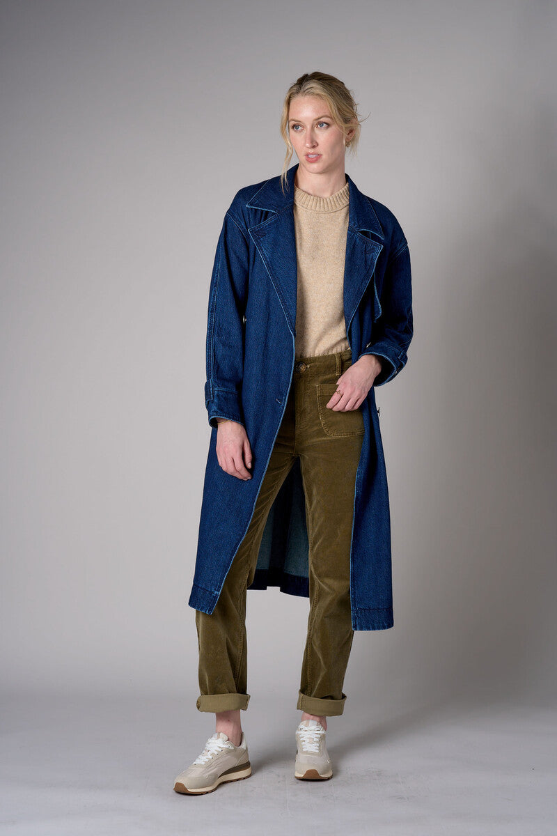 Indigo denim trench coat with a belted waist.