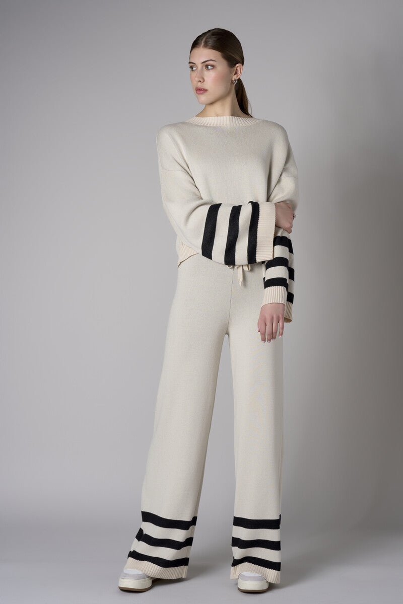 Step up your look with this unique 'Sand' Striped Leg Pant.