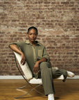 Let your outfit shine with this vibrant 'Light Olive' Side Stripe Lounge Pant.