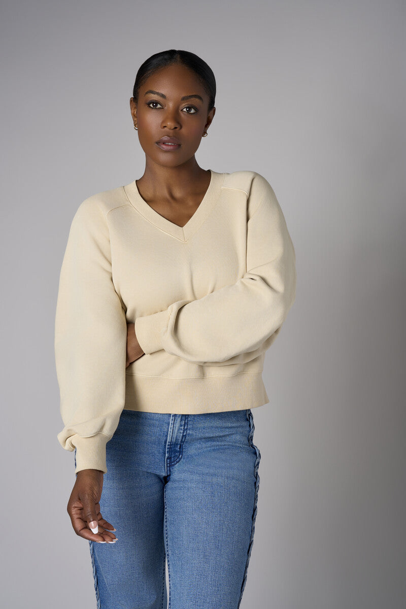 Bring your style to life with the 'Bone White' Zipper Back V-Neck Sweatshirt – perfect for any occasion.