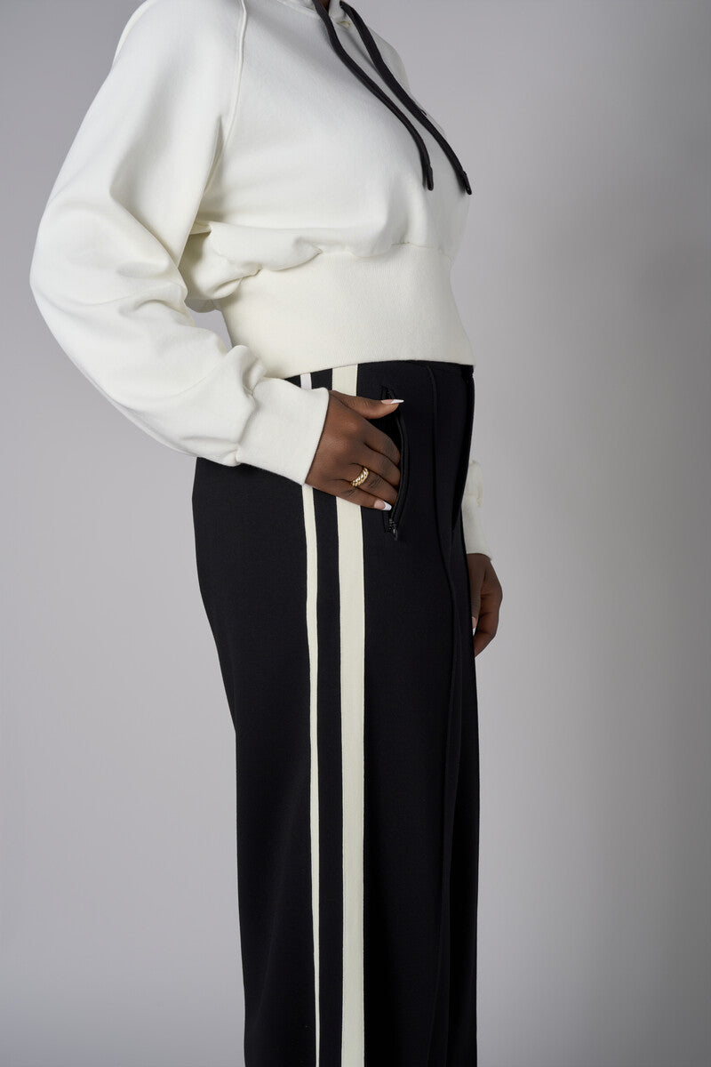 Add a pop of color to your look with the 'Ivory' Cropped Hoodie Sweatshirt.