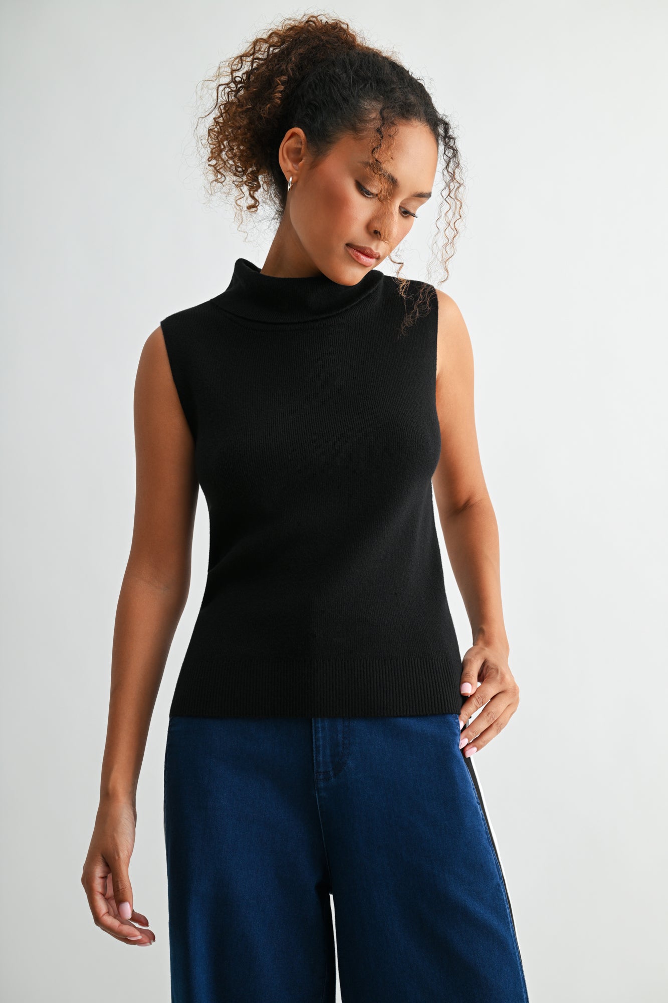 Black sleeveless turtleneck sweater