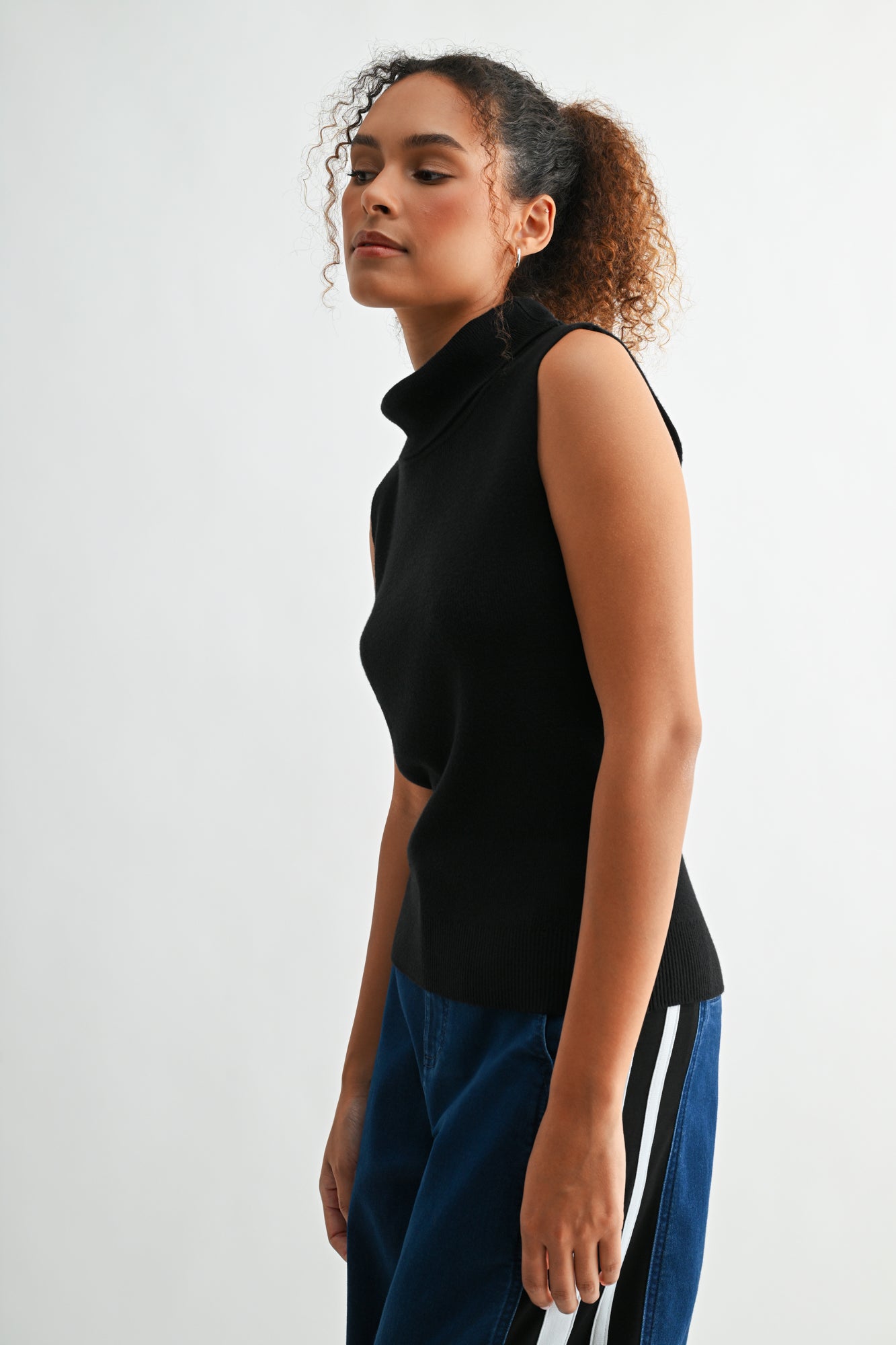 Black sleeveless turtleneck sweater