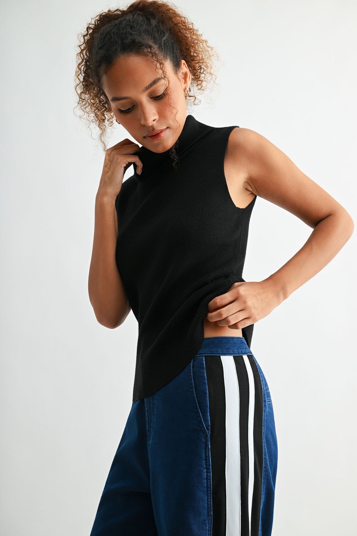 Black sleeveless turtleneck sweater