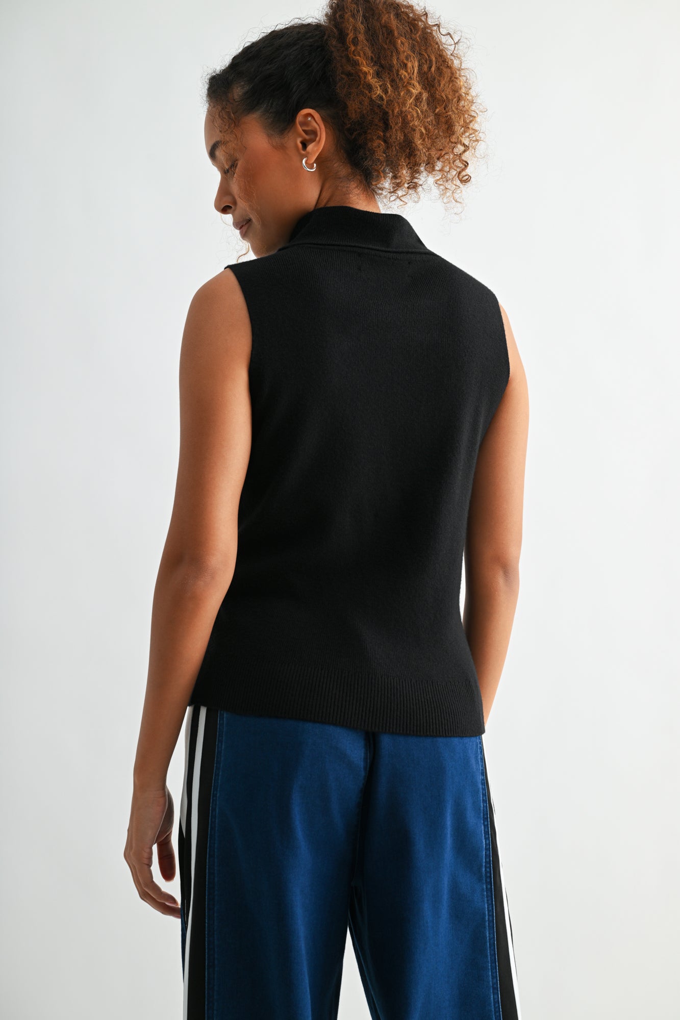 Black sleeveless turtleneck sweater