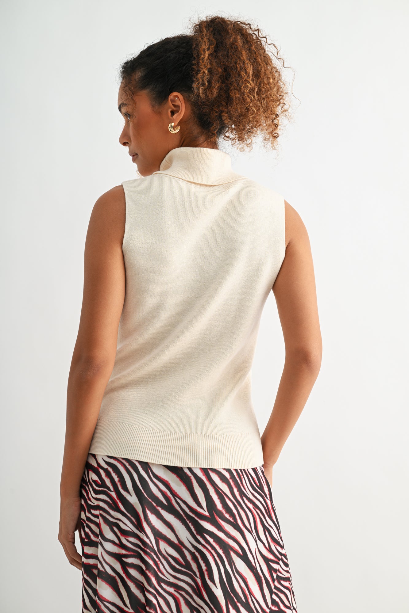 Bone White sleeveless turtleneck sweater