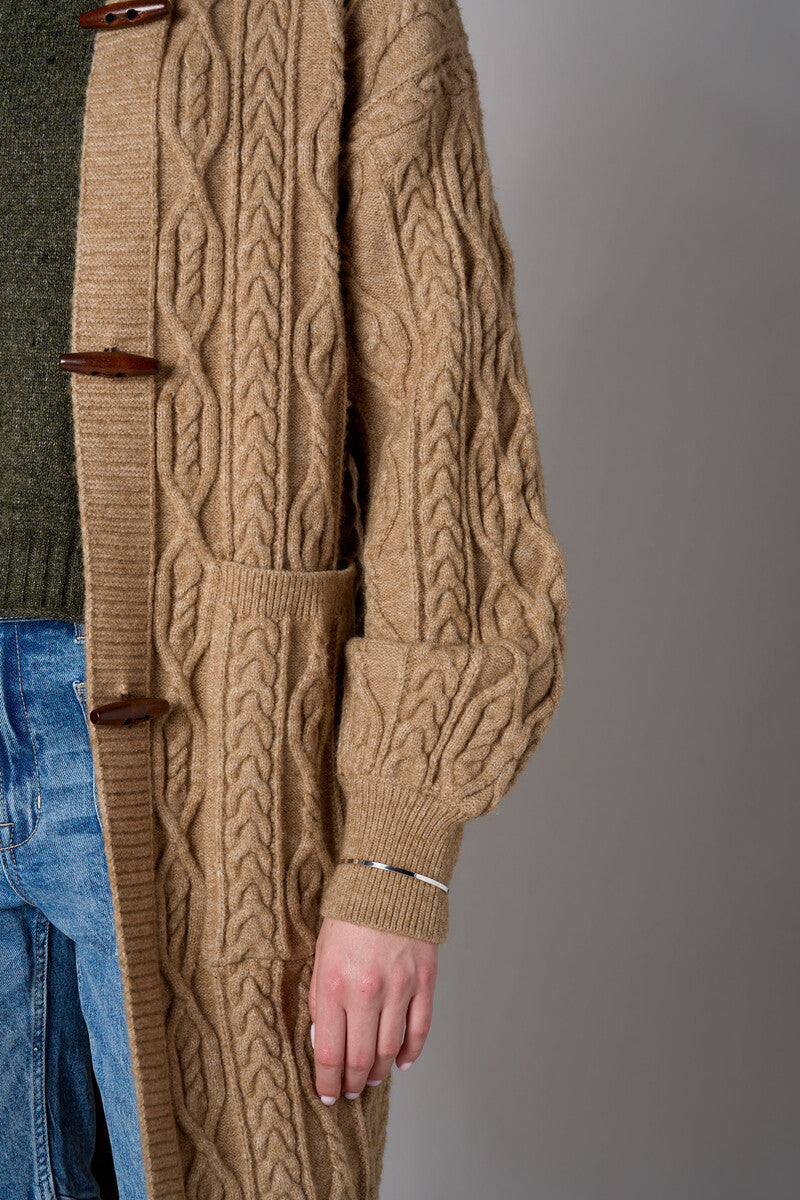 Brown cardigan with denim collar and button front closure.